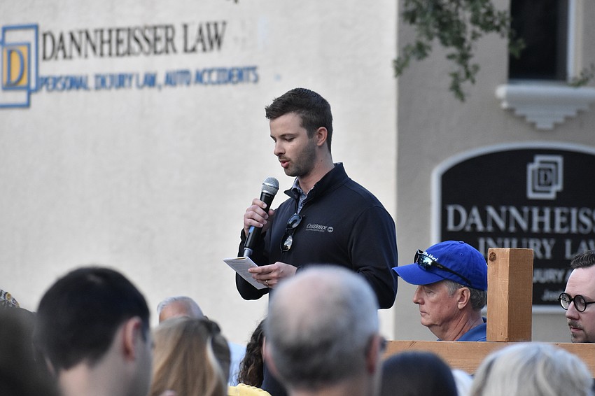 Fritz Maxwell of Church of the Redeemer speaks at the 2nd station.