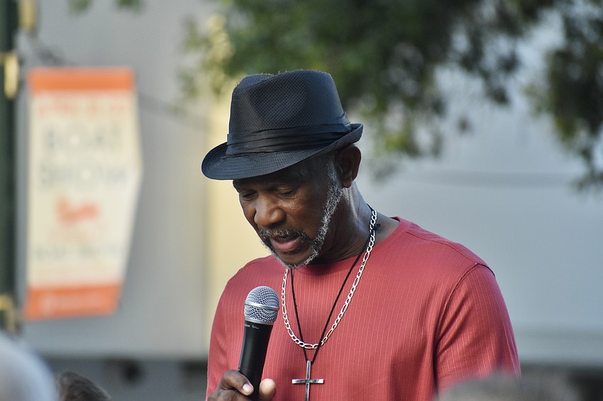 Wesley Tunstall, pastor of Koinonia Missionary Baptist Church and True Worship Church, and founder and CEO of Newtown Community Ministries United, speaks at the 5th station.