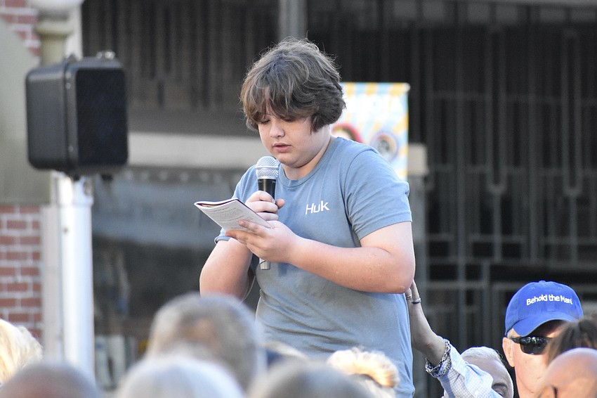 Rhett Morton of the Church of the Redeemer Youth Group speaks at the 9th station.