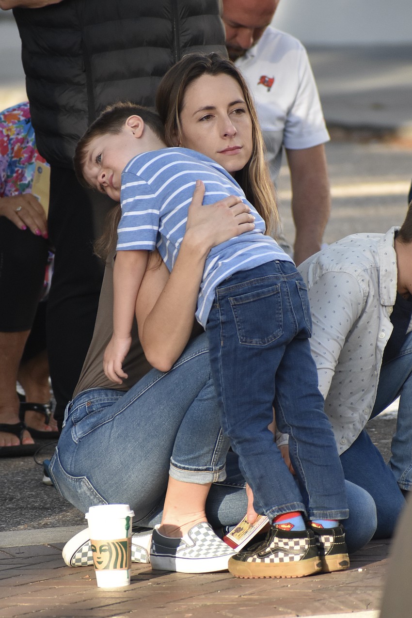 7-year-old Levi Siljestrom takes a rest on the shoulder of his mother Casey Siljestrom.