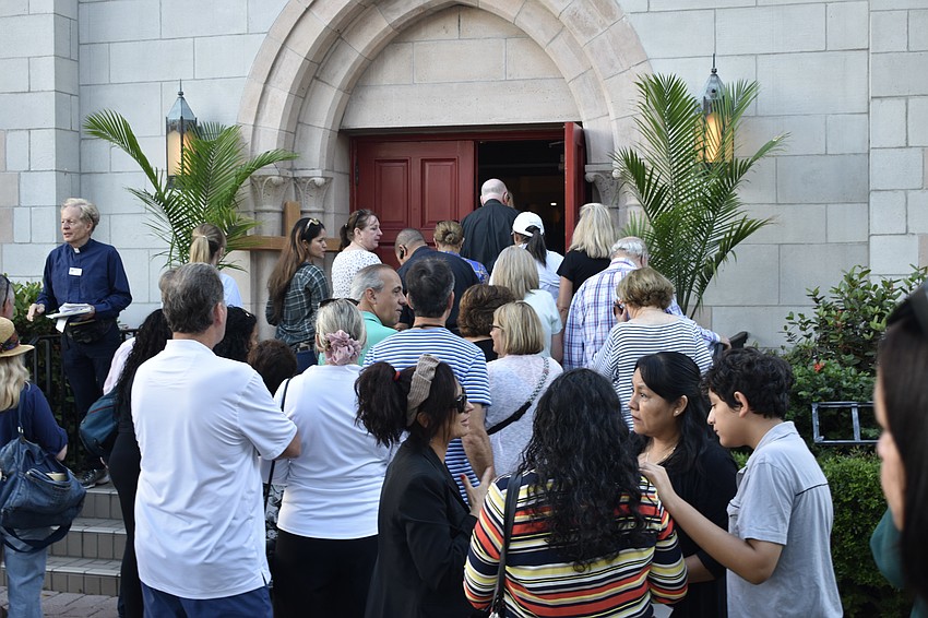 Walkers head inside Church of the Redeemer as the walk ends.