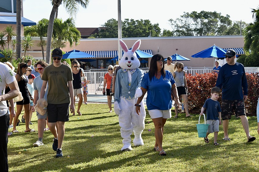 The Easter Bunny leads the way to the egg hunt.