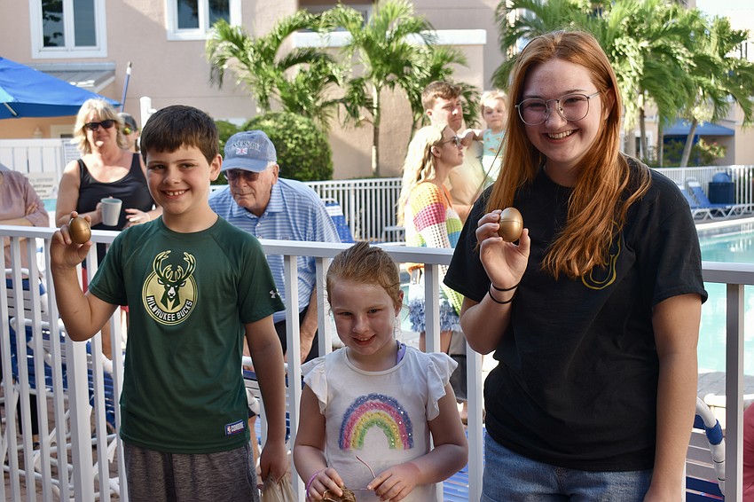 Ben Weber, Kiera Bourke and Kelly Olson get first choice on Easter baskets because they found golden eggs.