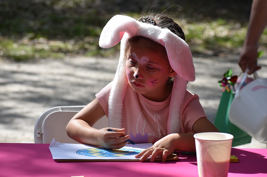 5-year-old Alex Martinez participates in Easter coloring.