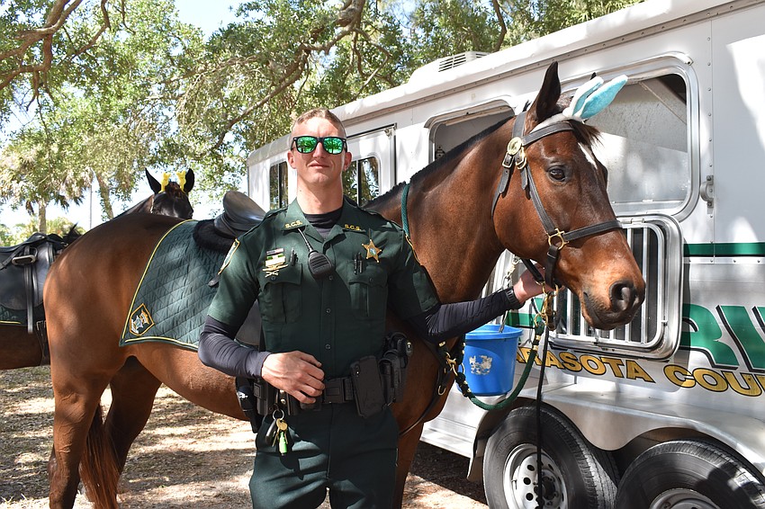 Kyle Martin, pictured with Colonel, was one of the deputies of the Sarasota County Sheriff's Office who attended to educate the public on the topic of mounted patrol.