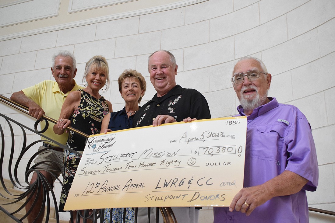 Lakewood Ranch's Bob Smith, Judy Balmer and Diane and Greg Brune and Gene Tischer, the president of Stillpoint Mission, celebrate Smith's donation of $70,380 to the nonprofit.