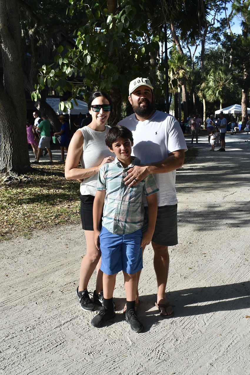 Siesta Key Chamber of Commerce Promotion and Event Manager Marisa Merlino with Walker Kinne and 8-year-old Liam Kinne