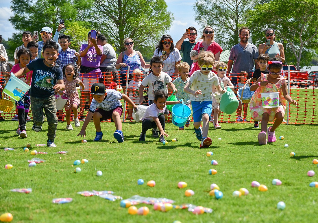 A sea of children rushed to the colorful eggs spreader on one of the at Bill Breeze Park.