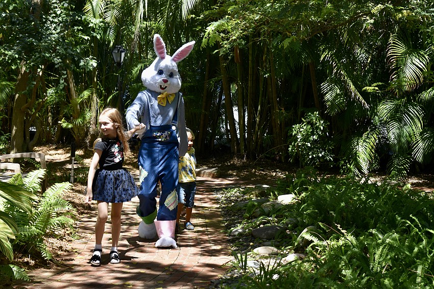 Valeria Anokhova leads the Easter Bunny in the conga line.