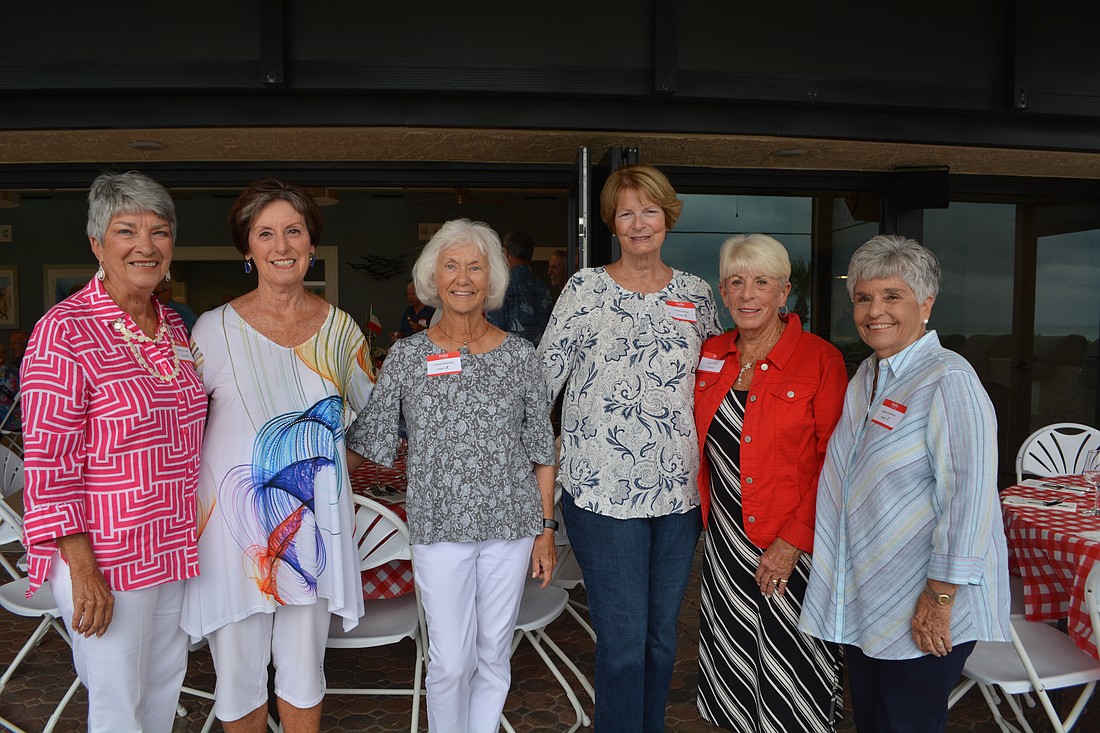 The event committee members, Mary DelPup, Betty Lou Miccio, Dottie Mueller, Nancy Hjort, June Hessel and Peggy Schwass, stand together before mingling with other guests.