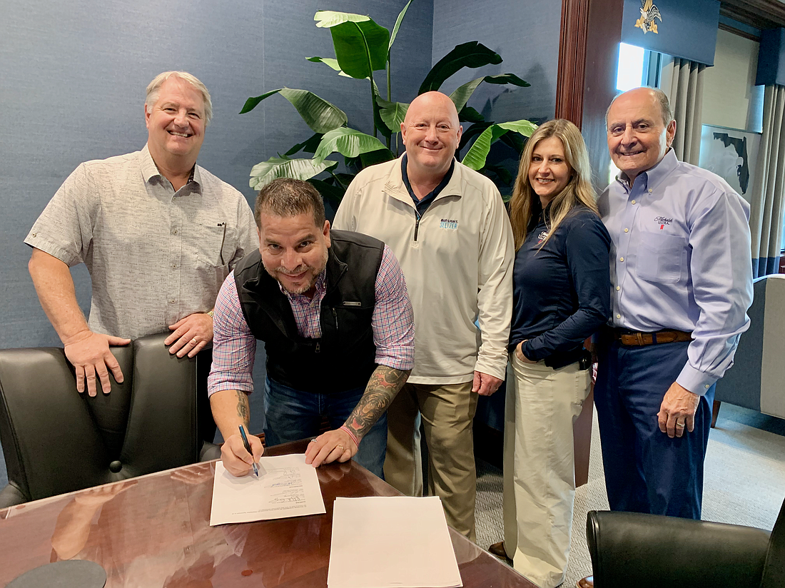 Darwin Santa Maria signed a distribution contract with Gold Coast Eagle. Also pictured is Andrea Saputo Cox, John Saputo, Robert Gray, Pat Bruenning, all with Gold Coast Eagle.
