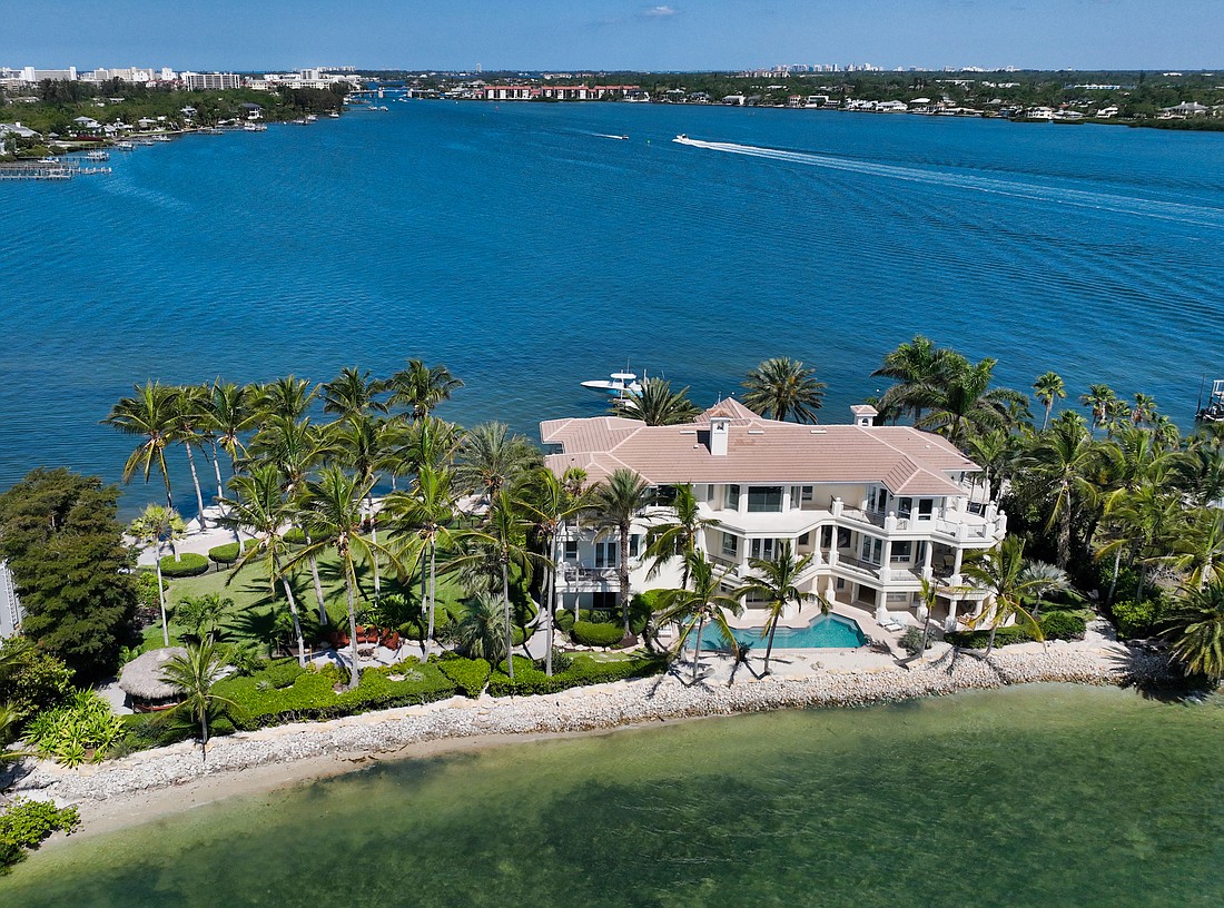 The listing at 1414 Point Crisp Road is surrounded by the waters of Little Sarasota Bay.