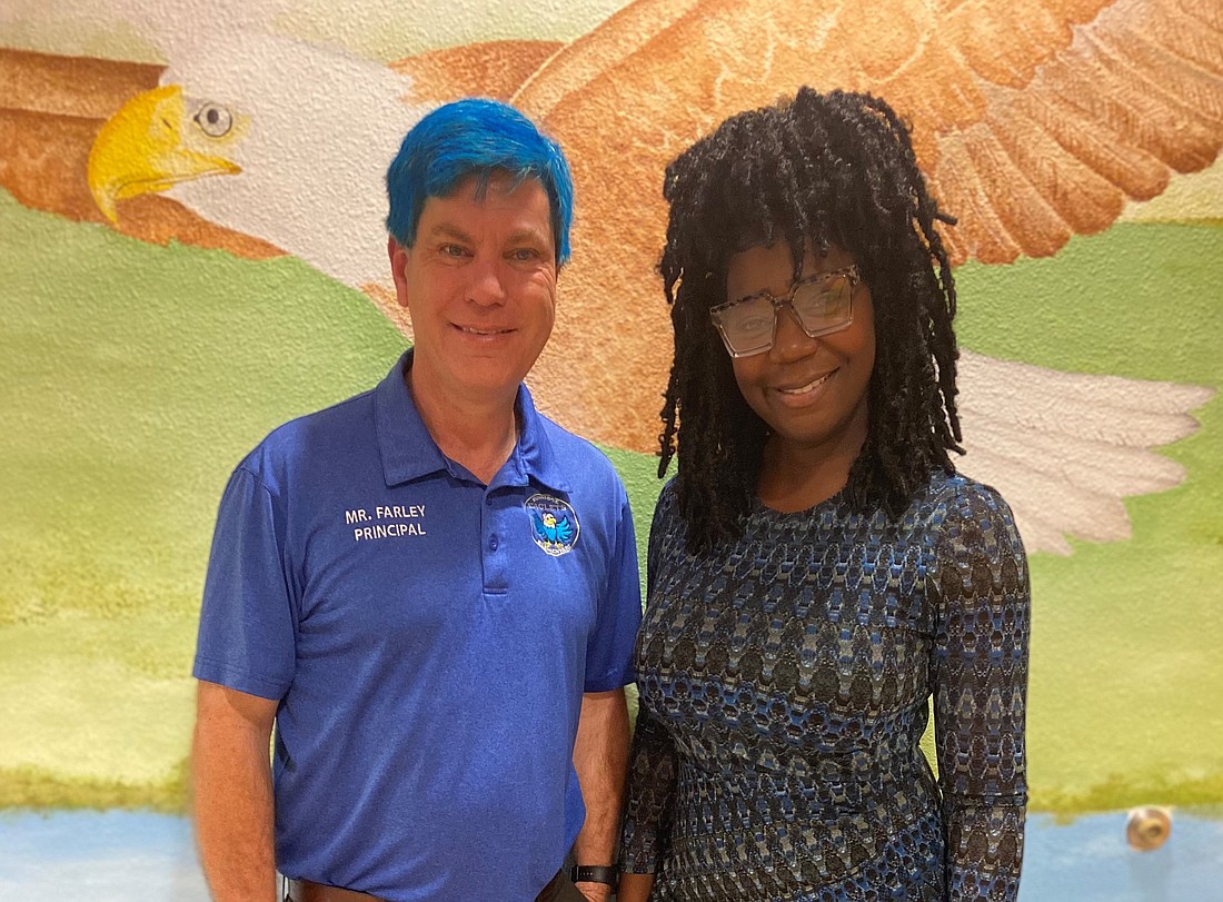 The SunRidge Elementary staff, including Assistant Principal Adasha Elmore, clamored for photos with Principal Douglas Farley and his blue hair.