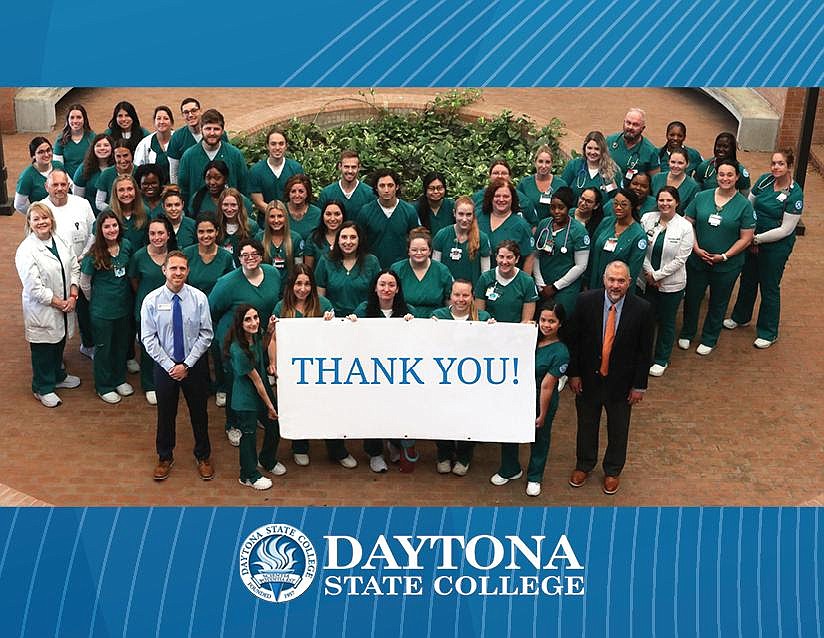 Daytona State nursing students and faculty in the Bob and Carol Allen School of Nursing join DSC President Tom LoBasso in thanking Gov. Ron DeSantis, the Florida Legislature, Halifax Health and AdventHealth for their support. Courtesy photo