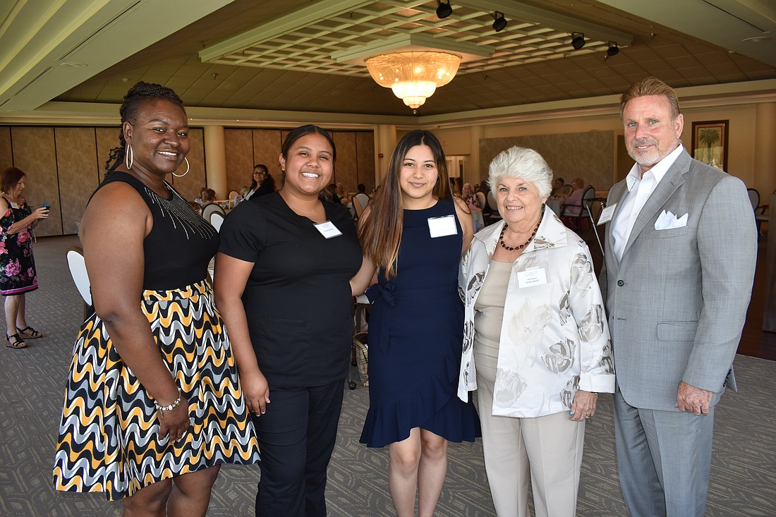 SCF student LaShawn'te Lee, MTC students Emma Ramirez and Krystal Camacho, Scholarship Committee Chair Peg Buck and SCF Foundation Chair Chris Romine pose for a photo during the Palm Aire Women's Club Scholarship Luncheon.