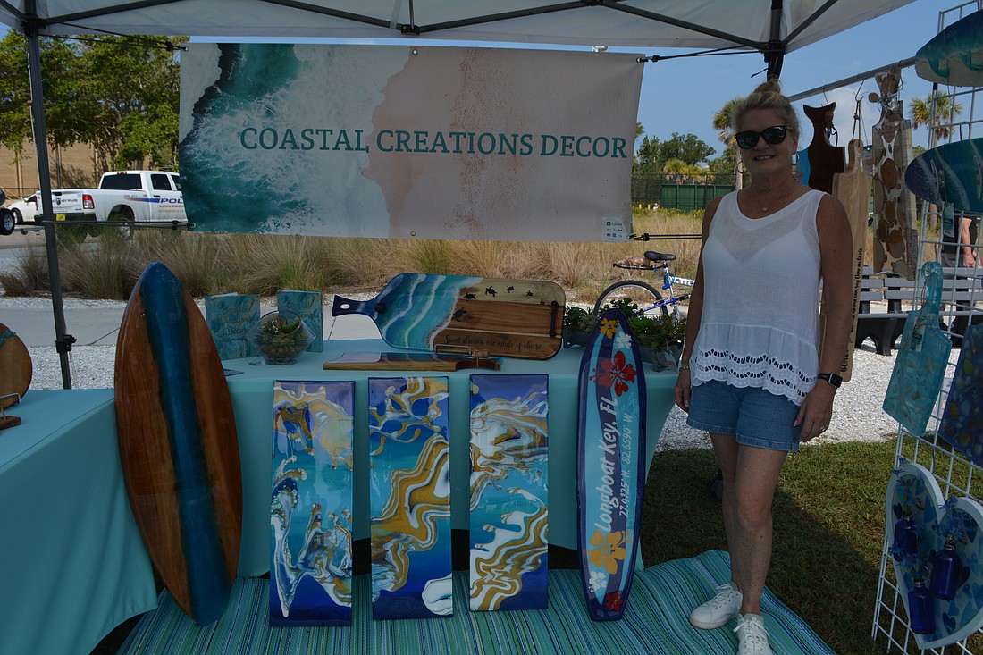 Janelle Wagman, owner of Coastal Creations Décor, stood alongside her designs made of wood and resin.