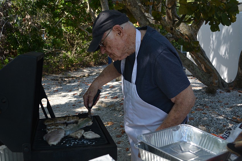 Lew Moyer (co-president) gets the perfect grill marks on the chicken.
