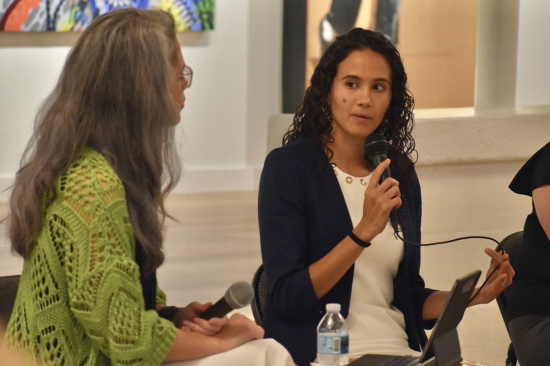 Dr. Stacie Herrera, owner of Herrera Psychology, speaks with photographer Karen Arango.