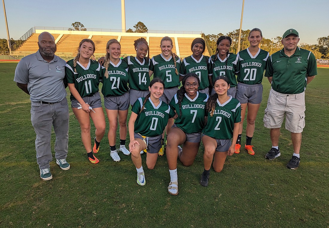The Flagler Palm Coast flag football team poses for a team photo after its 6-0 win over DeLand in a District 3-2A quarterfinal.