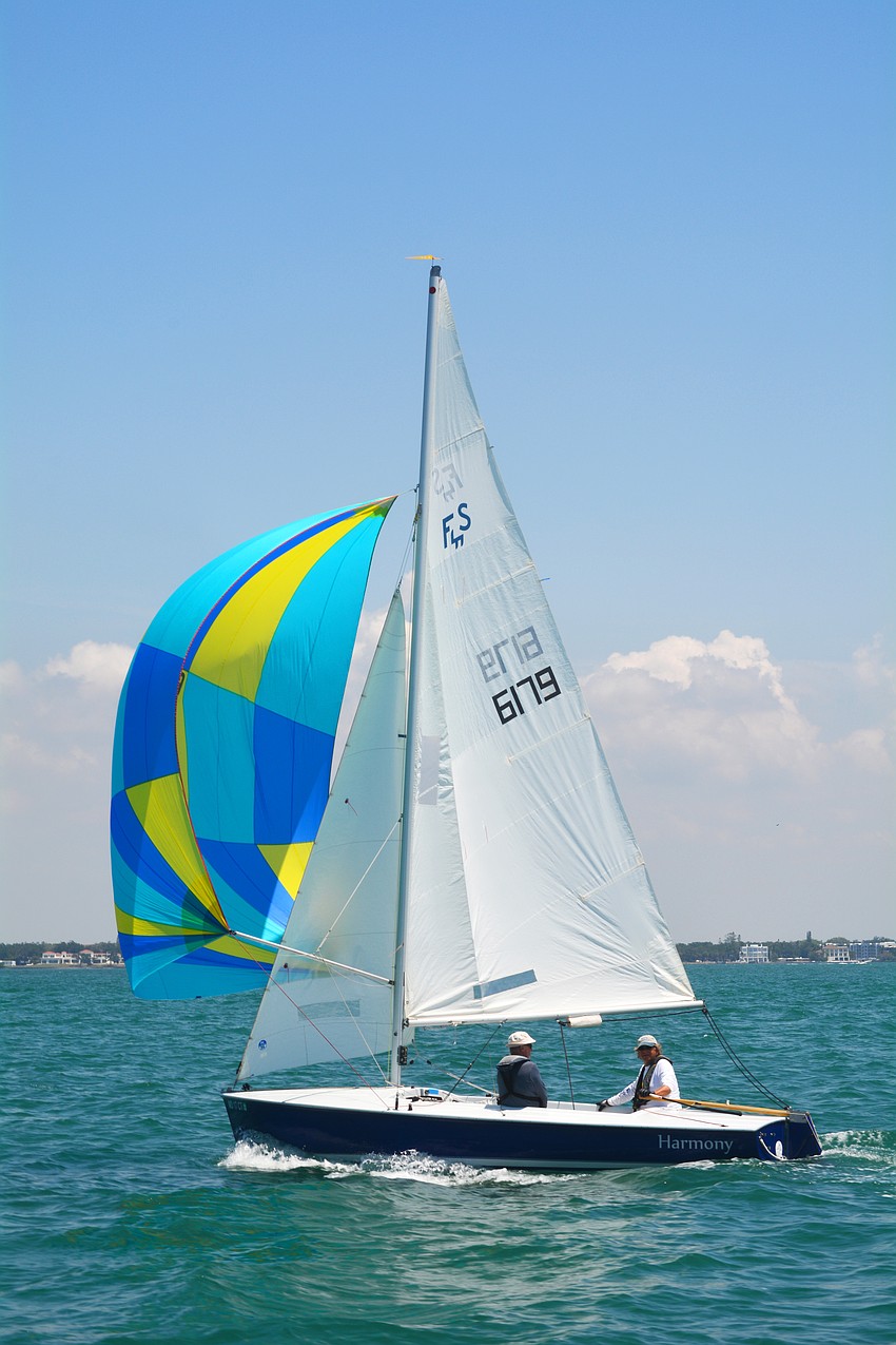 The crew on Harmony sails on a beautiful day at the Bird Key Yacht Club Sarasota Bay Club Regatta.