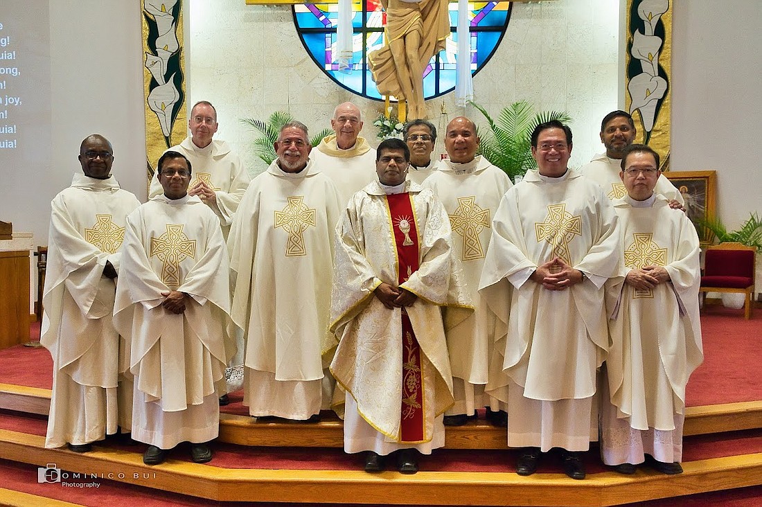 Rev. Justin K. Vakko celebrates his 25th anniversary of ordination to the Catholic priesthood with other Catholic priests from the area. Courtesy photo