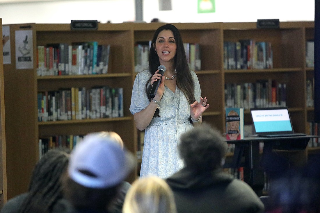 Tiffany Rosenhan, author of the young adult spy thriller, "Girl From Nowhere" speaks to Flagler Palm Coast High School students on April 6 in the media center. Photo by Brent Woronoff