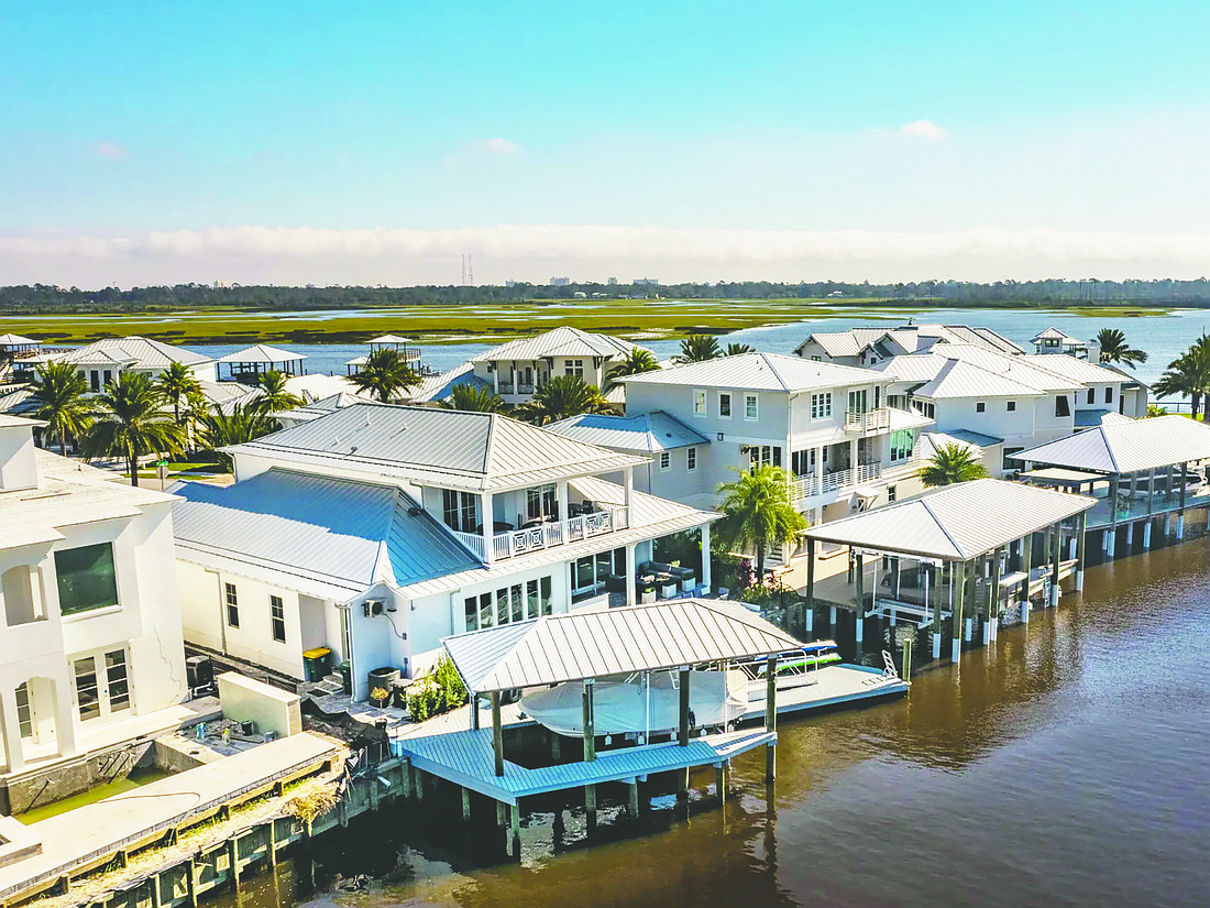 This two-story home with Intracoastal Waterway access features four bedrooms, three full and one half-bathrooms, bonus room, loft. walk-in attic, summer kitchen, deck, spa, covered boatlift, floating dock, generator and two-car garage.