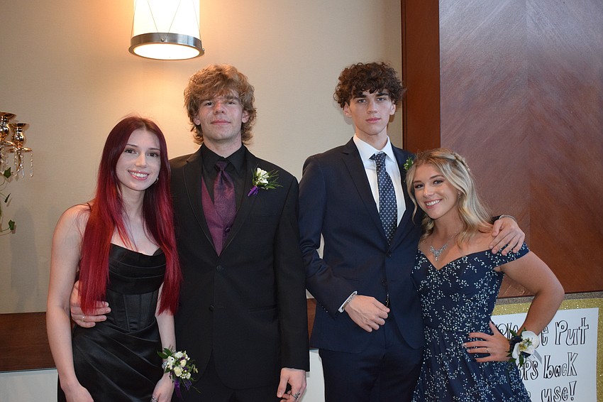 Seniors Kaitlyn Harper, Ryan Garrison, Tyler Woodin and Ali Thomas say it feels great to be at prom.