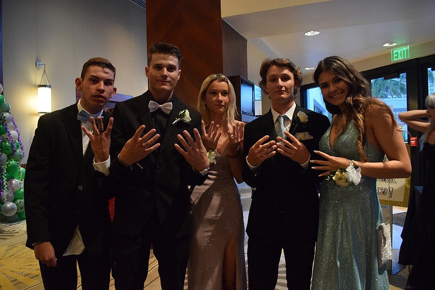 Seniors Nick Misuar and Tyler Howald, juniors Brooke Harris and Alex Vaillancourt and sophomore Makenna Elliott have fun together at prom.