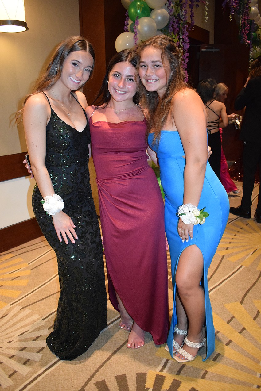 Seniors Darcey Bullas, Kate Tuchman and Eden Gibbs are thrilled to be at prom. Tuchman says her senior prom is bittersweet.