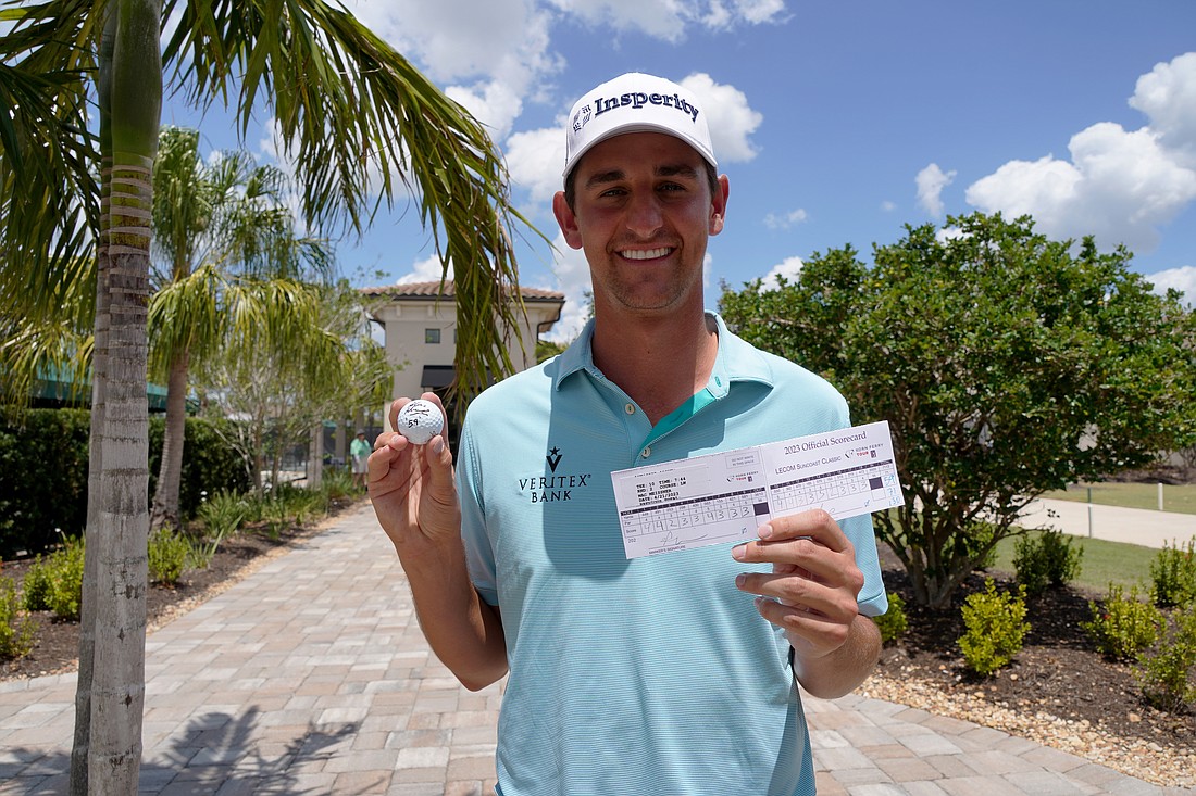 Mac Meissner shows off his ball and scorecard after round two of the 2023 LECOM Suncoast Classic. Meissner shot 59 (12 under par) in round two after an even par round one and sits 12 under par for the tournament.