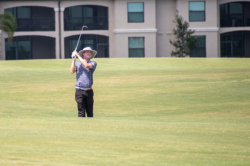 Joe Highsmith hits his second shot on the No. 18 hole at Lakewood National. Highsmith shot 2 under par in round three of the 2023 LECOM Suncoast Classic and is 11 under par for the tournament.