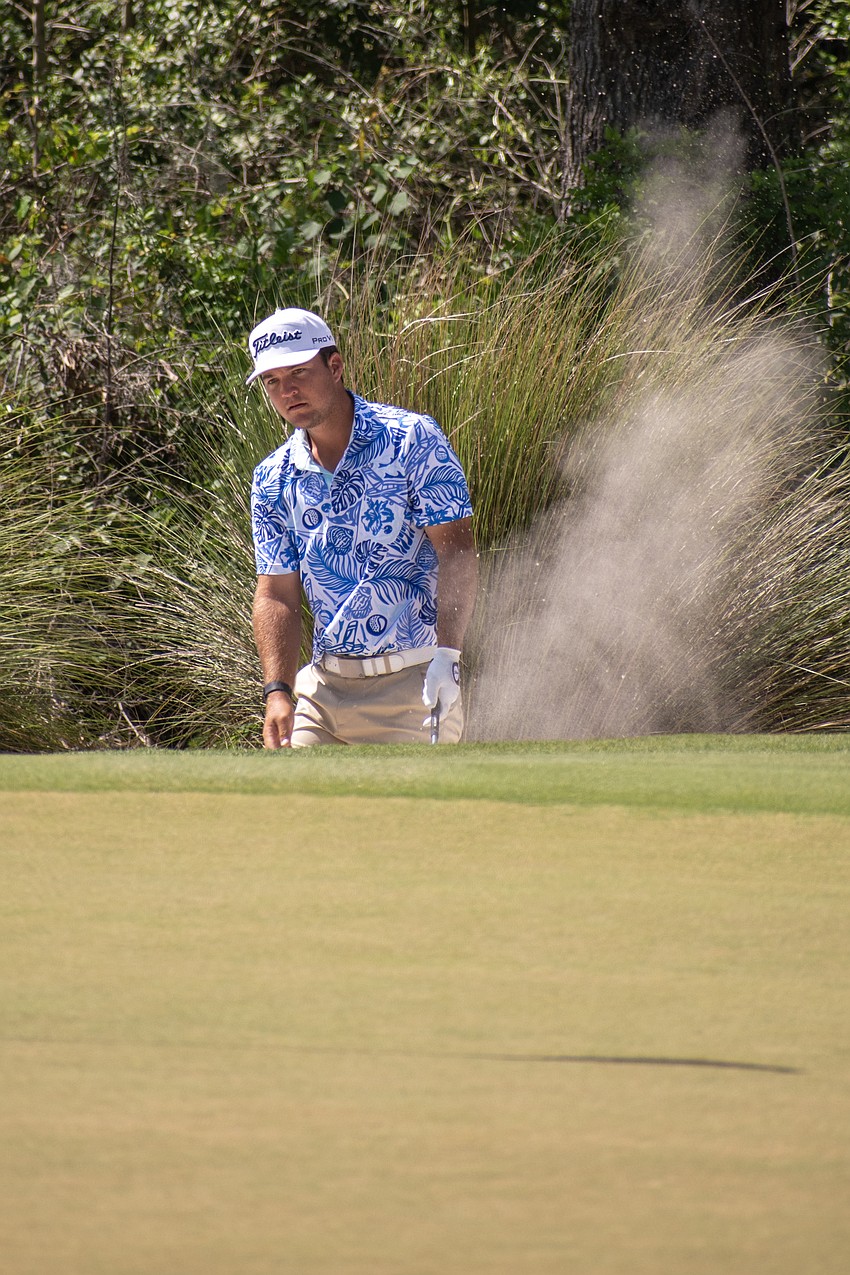 Andrew Kozan stares into the distance after failing to get his shot out of a sand trap on the No. 16 hole at Lakewood National. Kozan shot 1 under par in round three of the 2023 LECOM Suncoast Classic and is 11 under par for the tournament.