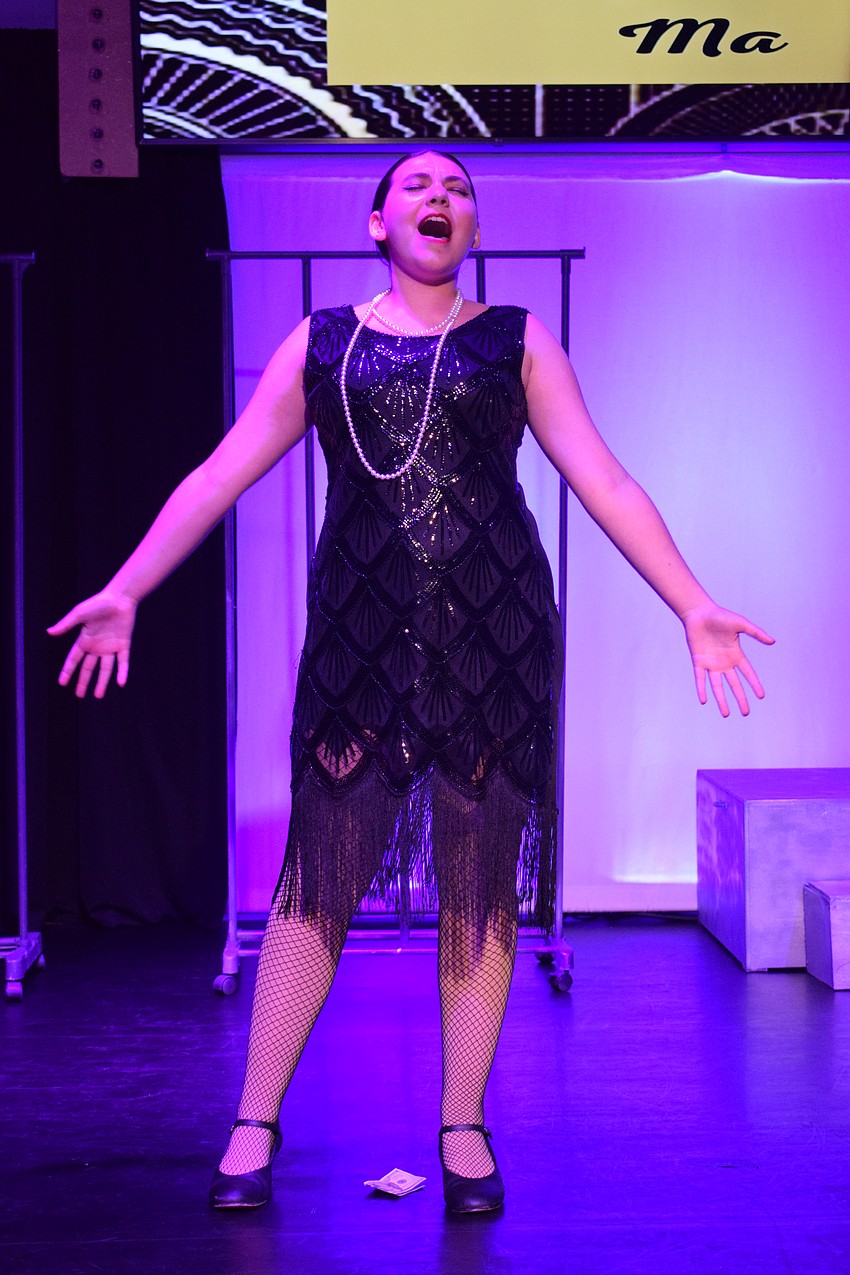 Olivia Holden belts out a note as Mama Morton.