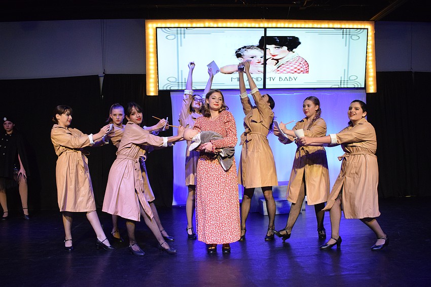 Reporters follow Roxie, who is played by Madelyn Benner, around to report on the news of Roxie having a baby.