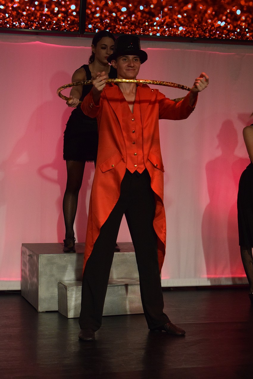 Ethan Benner plays the razzle ring leader during 