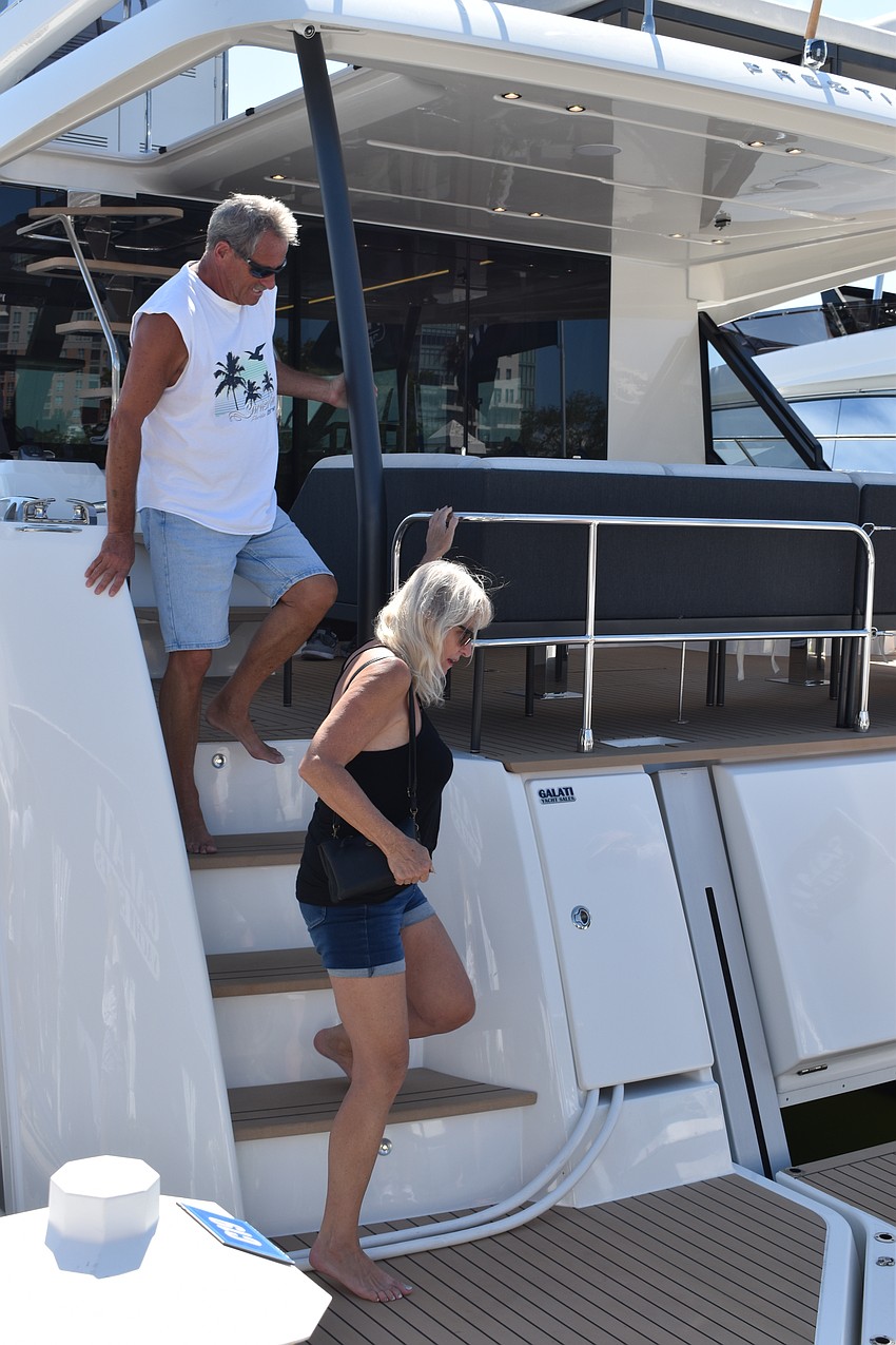 Joe Grodzik and Cathy Roberson explore a yacht.