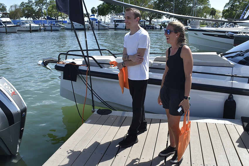 Logan Gardner and Lauren Uslin browse the boats on display.