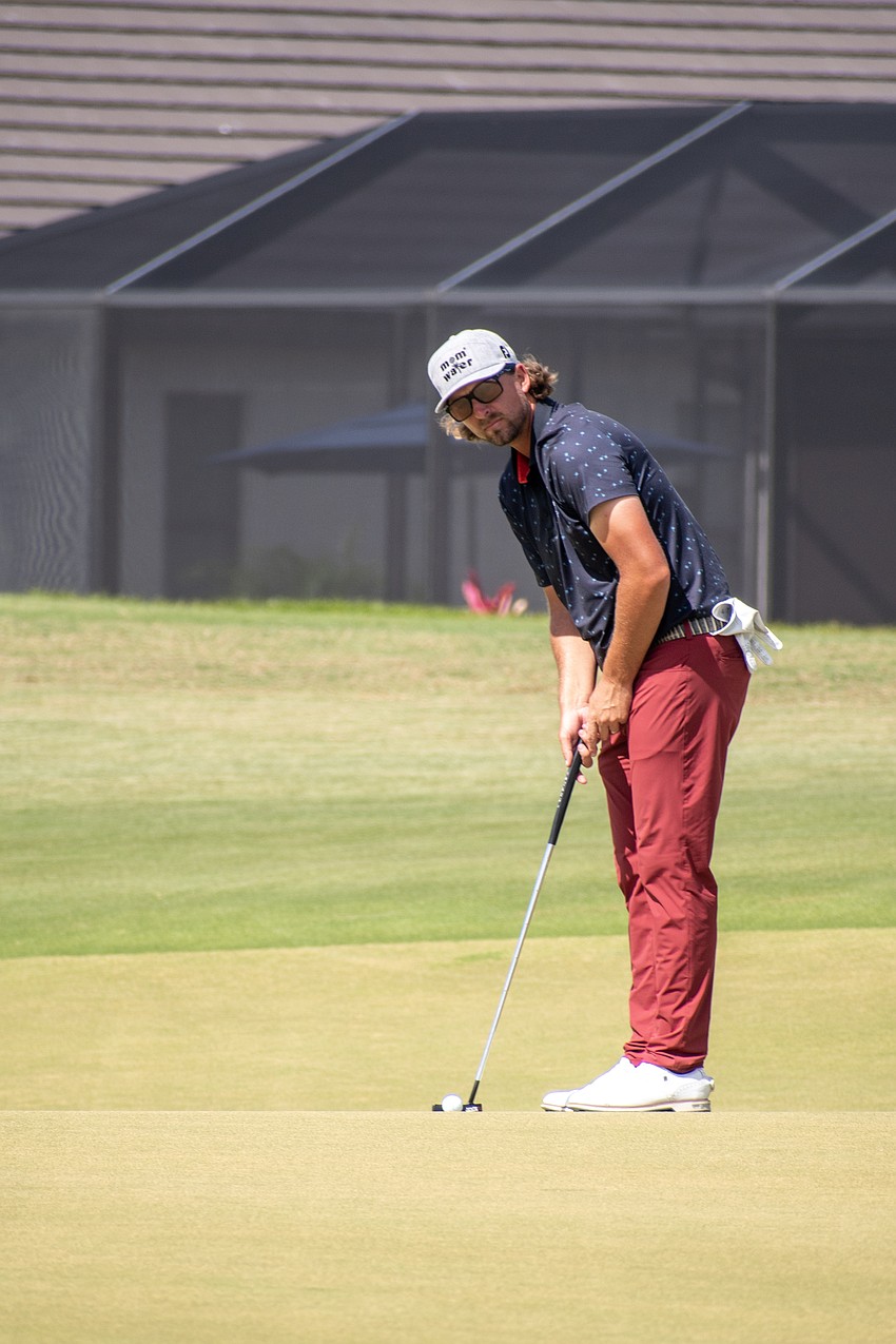 Rhein Gibson putts on the No. 17 hole at Lakewood National.