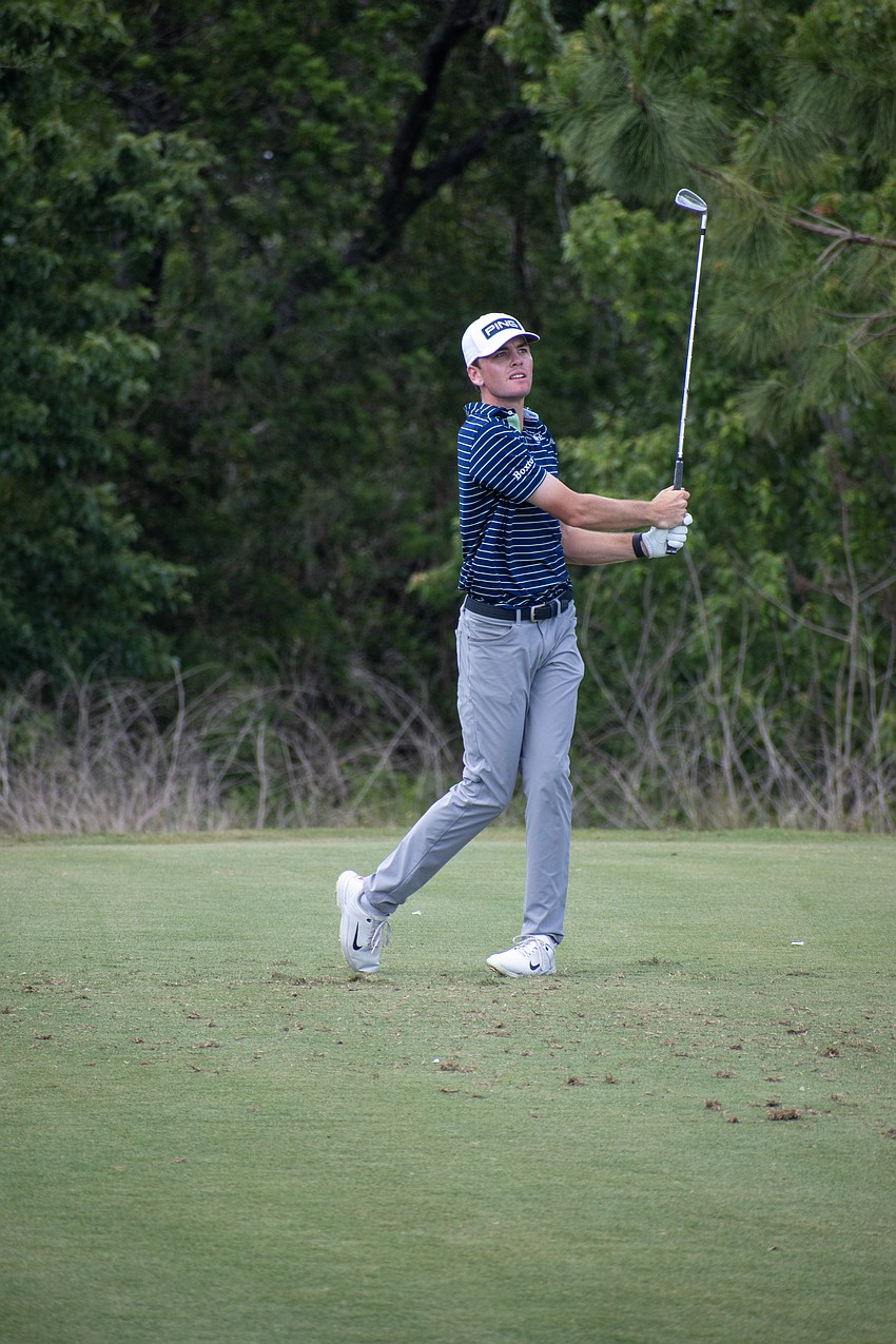 Logan McAllister hits his tee shot on the No. 17 hole at Lakewood National.