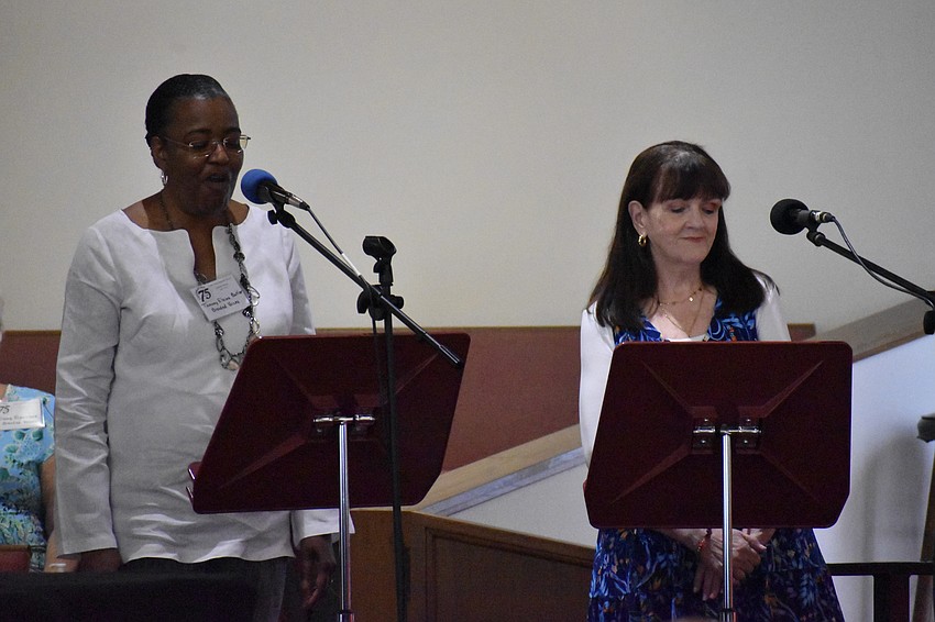 Tammy Elaine Butler and Janene Young sing during the service preceding the celeberation.