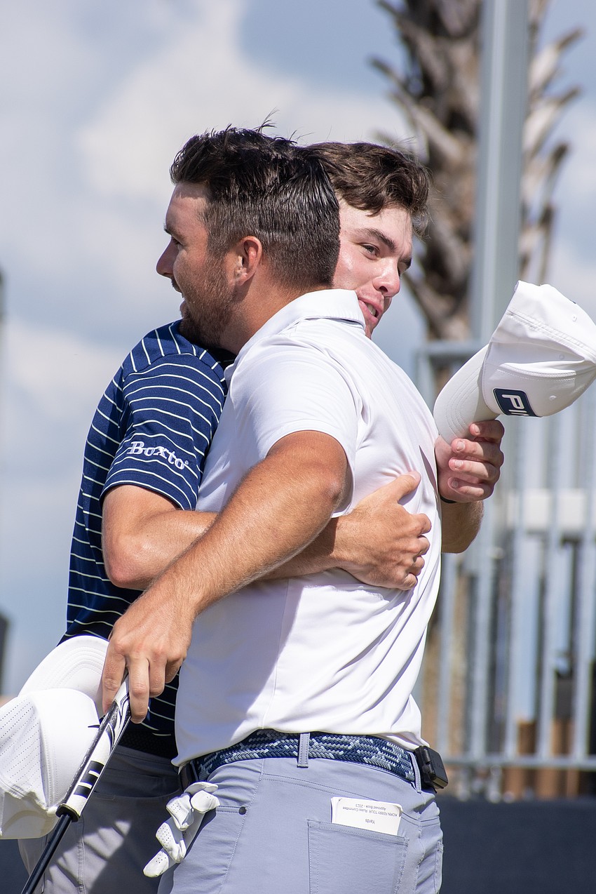 Logan McAllister and Chris Gotterup hug after their Sunday rounds at Lakewood National.