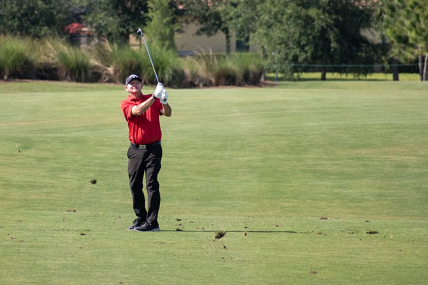 Tommy Gainey hits his second shot on the No. 18 hole at Lakewood National. Gainey finished the tournament 17 under par.