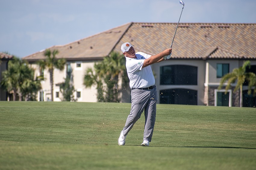 Scott Gutschewski hits his second shot on the No. 18 hole at Lakewood National.