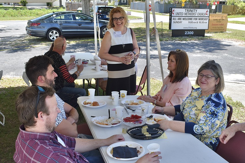 Leon Milner, Joe Barnett, Southwest District Superintendent for the Florida Conference of the United Methodist Church Deborah Allen, Tammy Barnett, and Marla Wagler enjoy a conversation over lunch.