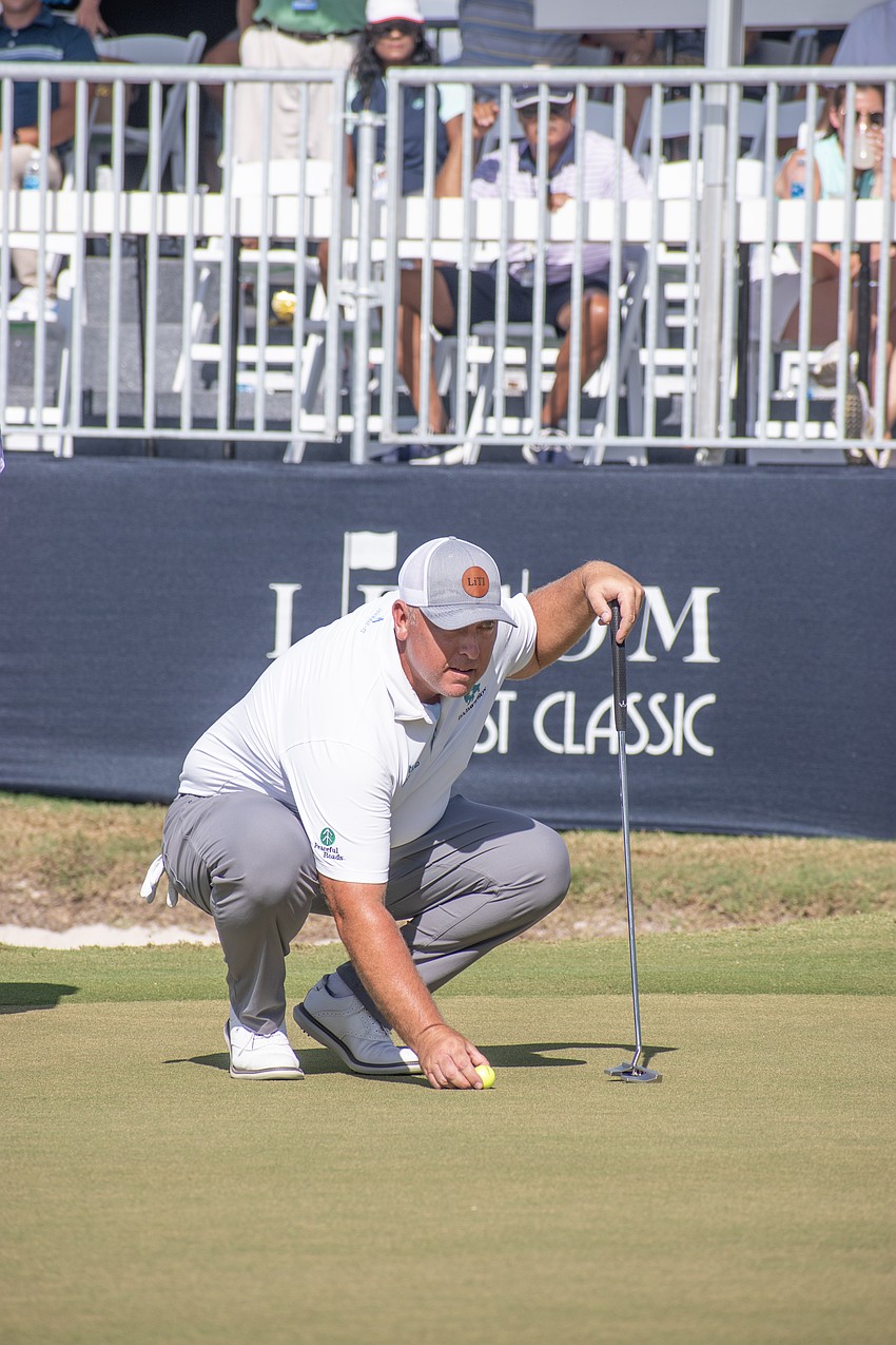 Scott Gutschewski lines up a putt on the No. 18 green at Lakewood National.