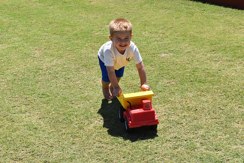 Lakewood Ranch's Dominik Schack, 2, finds a good use for the Sarasota Polo Club field before the horses come out.