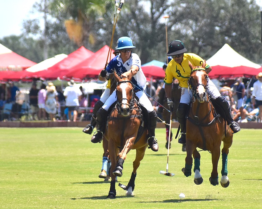 North South Wealth Management/Avalon Farms' Martin Eddy races for the ball against Whiskey Pond/Columbus Realty's Devin Vass.