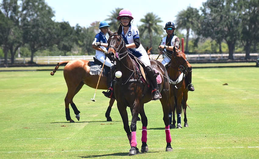 Hanna Hornung of North South Wealth Management/Avalon Farms watches her shot soar into the goal to start the scoring April 23 in a match at the Sarasota Polo Club.