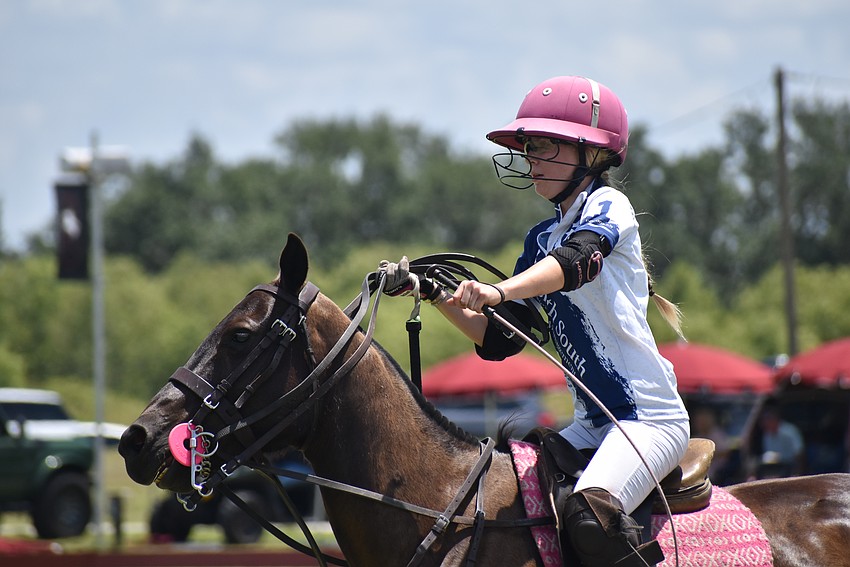 Hanna Hornung has her hands full during Sunday's match at the Sarasota Polo Club.